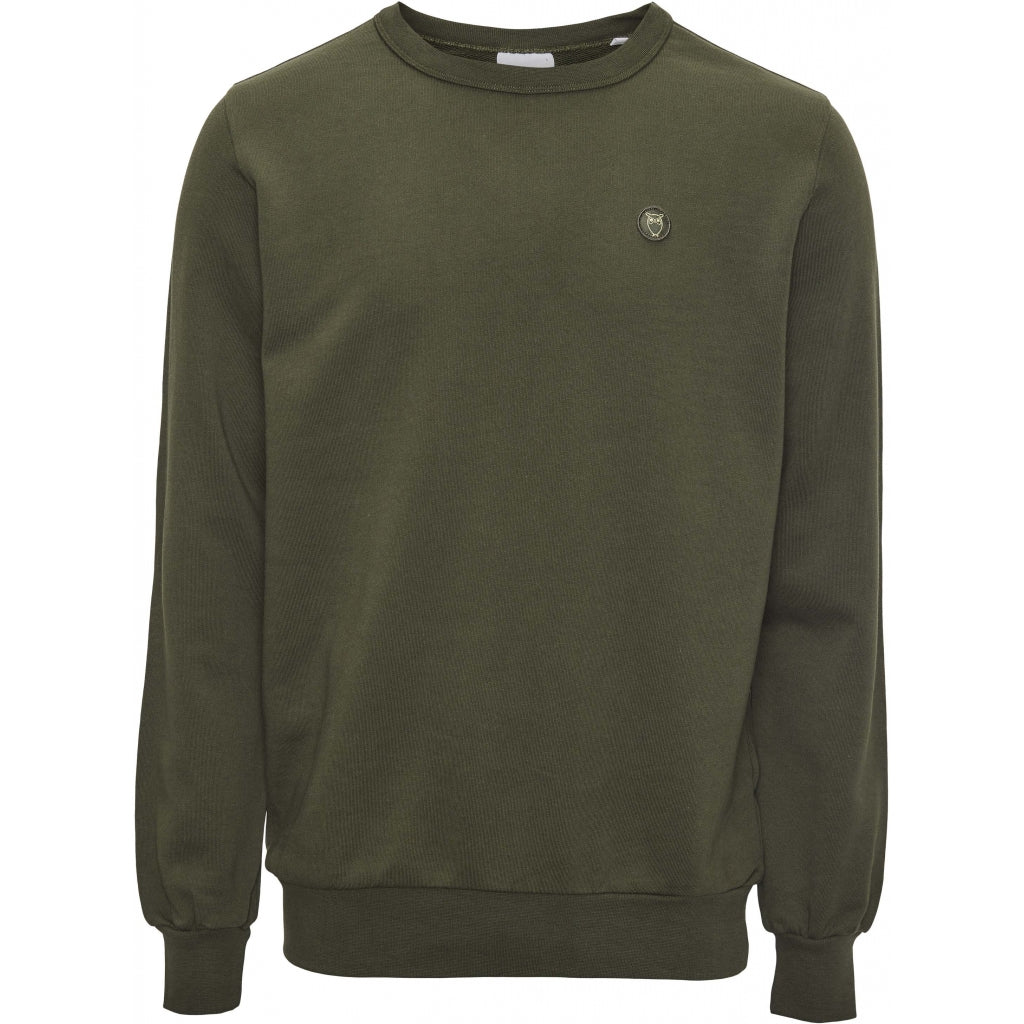 Knowledge Cotton , Hoodies & Sweats in regular Classic fit. ELM basic badge sweat - GOTS/Vegan  Chosen in a Forrest Night  colour.